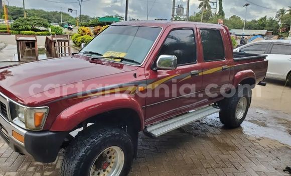 Buy Used Toyota Hilux Red Car in Dar es Salaam in Dar es Salaam