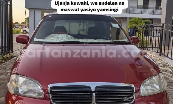Nunua Ilio tumika Toyota Starlet Nyekundu Gari ndani ya Dar es Salaam nchini Dar es Salaam