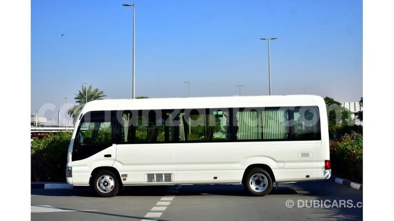 Big with watermark toyota coaster arusha import dubai 7860